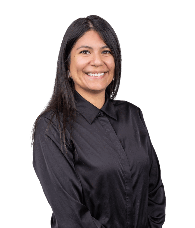 A woman with straight black hair, wearing a black button-up shirt, smiles while standing against a plain white background.